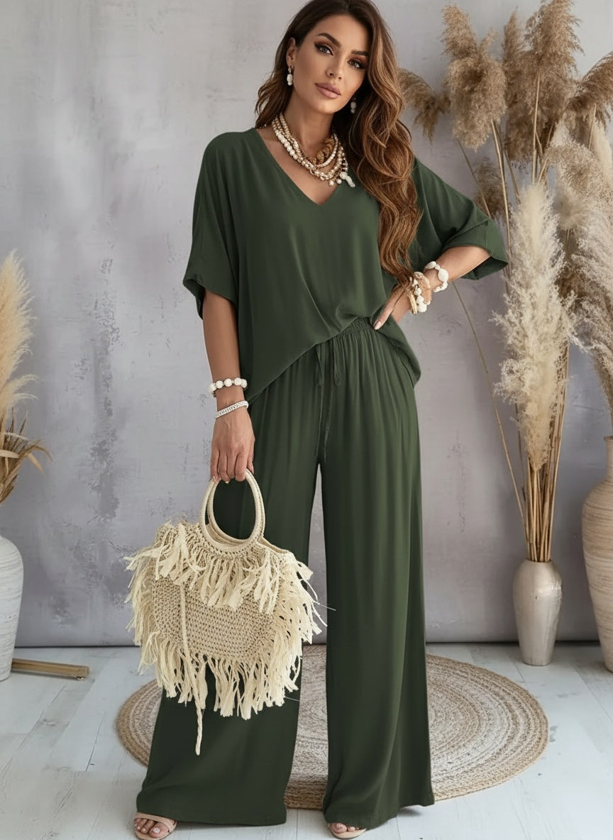 Cross Border Europe and America 2025V Collar Bat Sleeve Casual Loose Wide Leg Pants Set for Women


Introducing the Cross Border Europe and America 2025V Collar Bat Sleeve Casual Loose Wide Leg Pants Set for Women, a perfect blend of style and comfort designed for the modern woman. This versatile set is ideal for various occasions, from casual outings to relaxing at home. The batwing sleeves and wide-leg pants offer a relaxed fit, making it an excellent choice for warm spring and summer days. Pair it with y